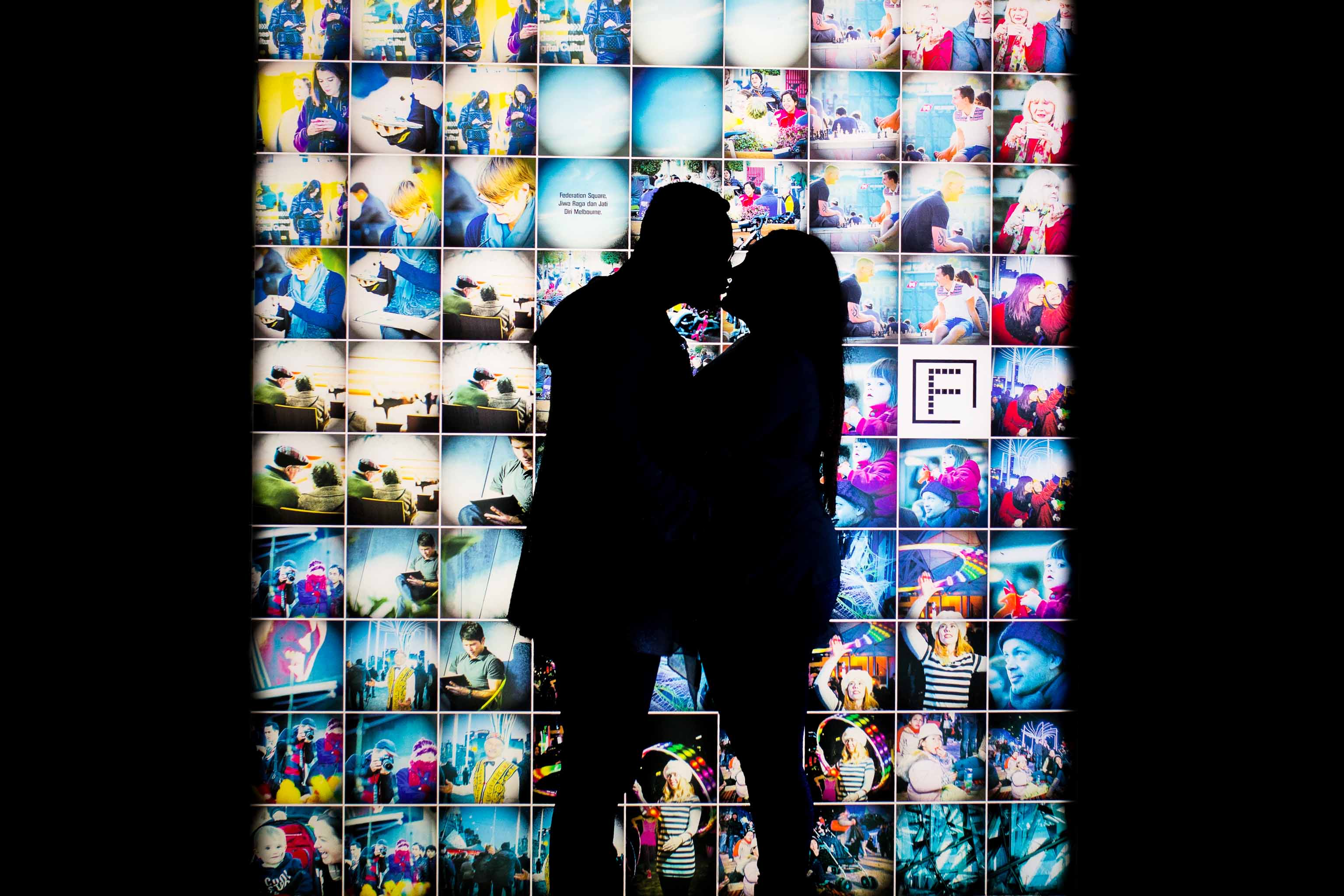 image of couple silhouette taken during city engagement session at federation square