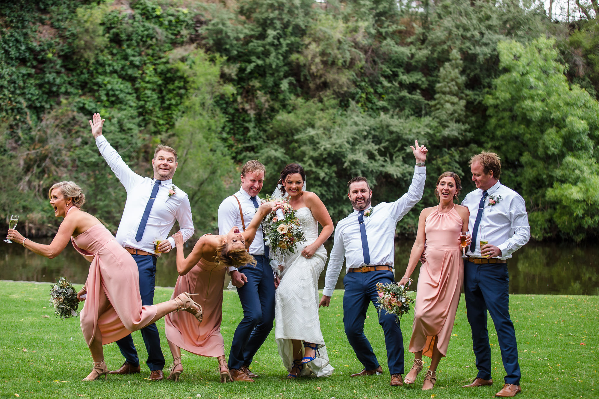 wedding party or bridal party playing games during portraits