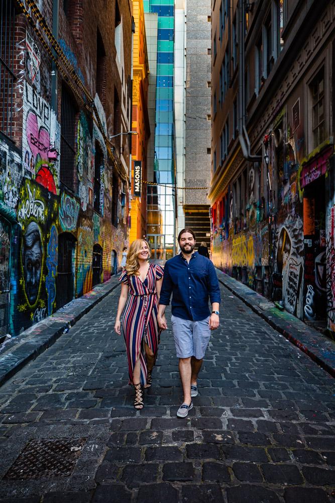 melbourne couple walking and holding hands in melbourne lane way