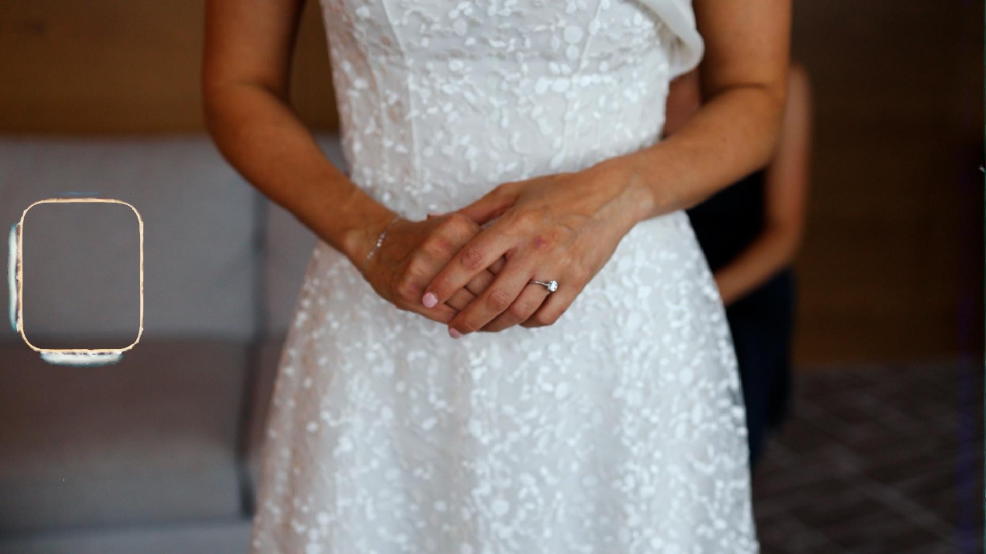 close up of brides hands with the engagment ring highlighted