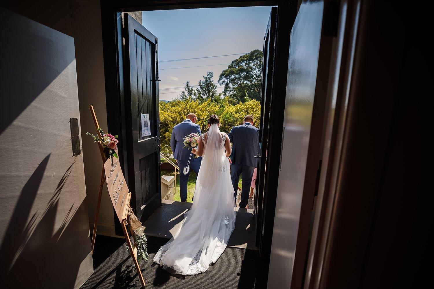 bride and groom leave the church