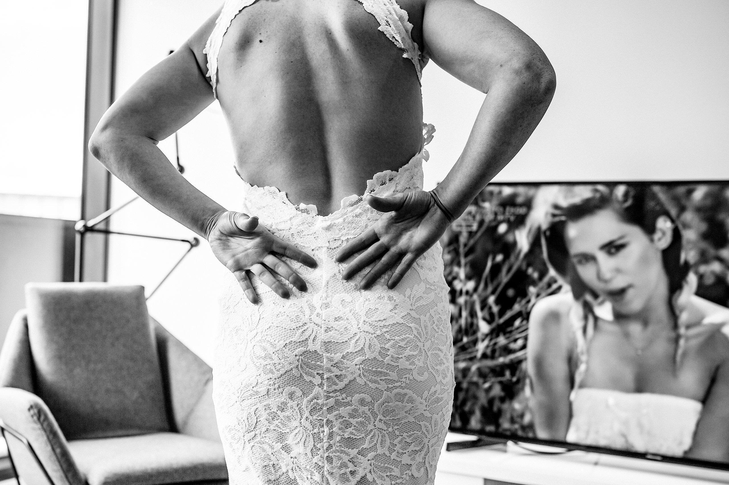Close up of the back of the Brides Grace Loves Lace wedding dress before two ton max wedding.