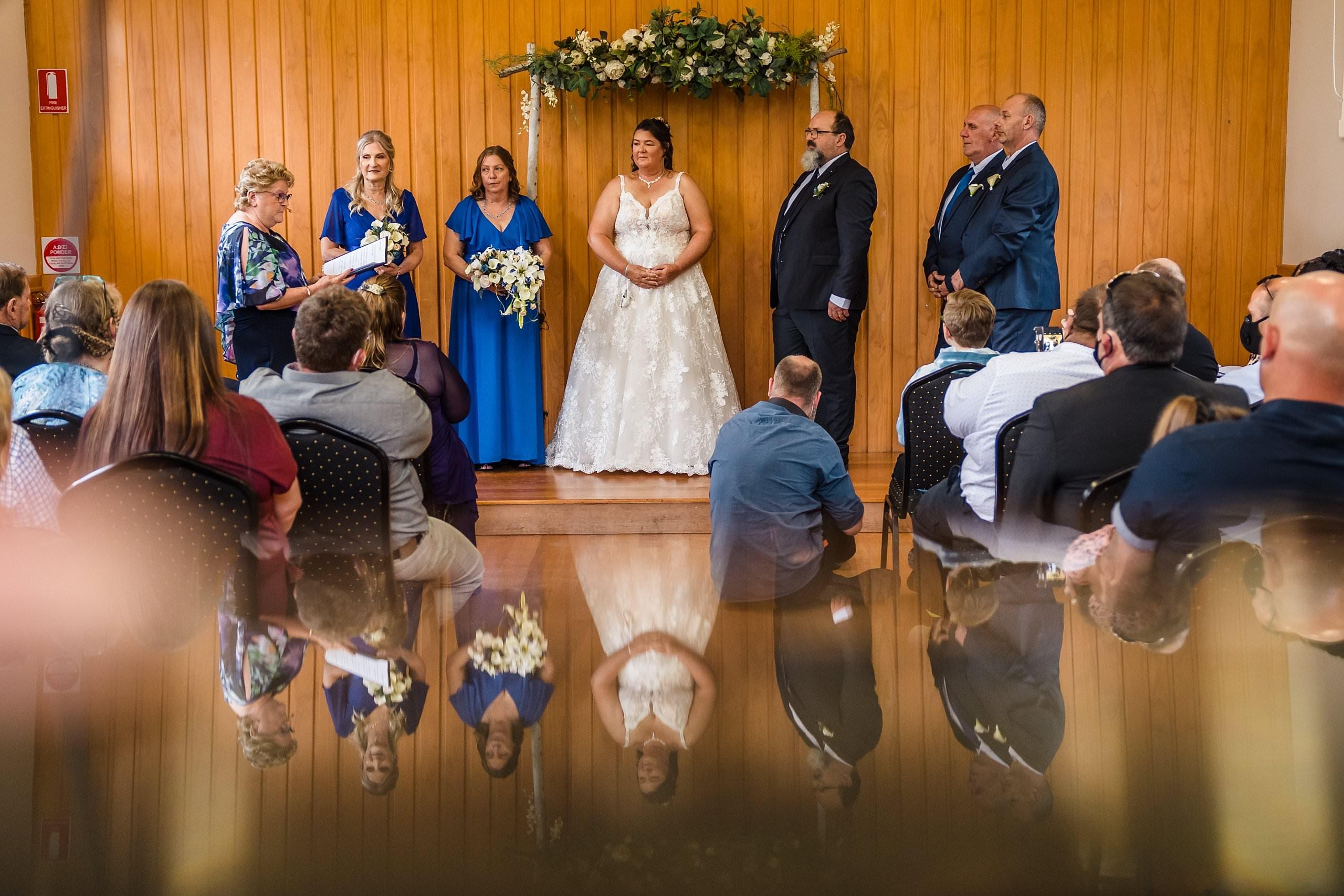 wide reflection view of the wedding ceremony 