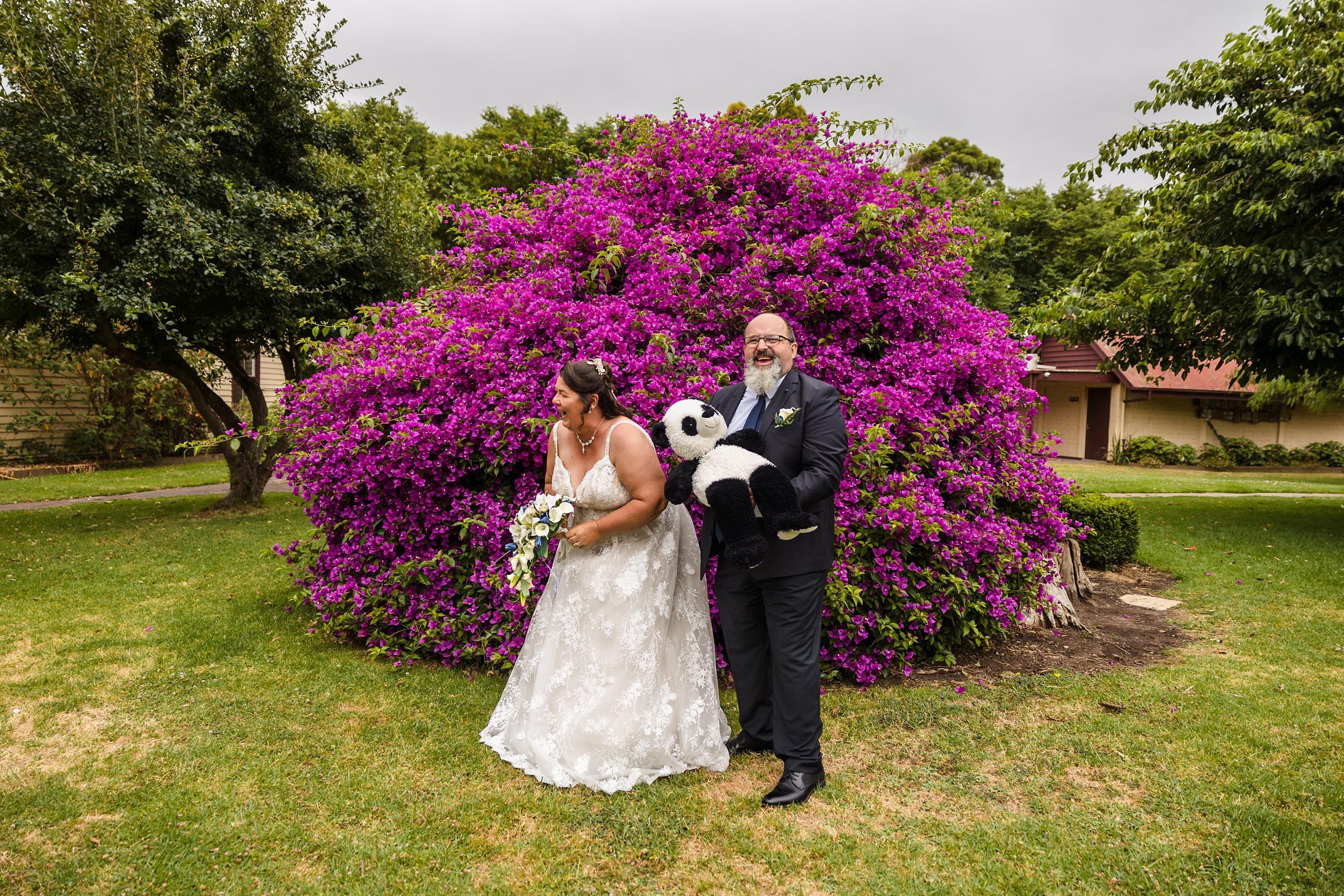 old cheese factory wedding portraits in front of the bush covered in purple flowers