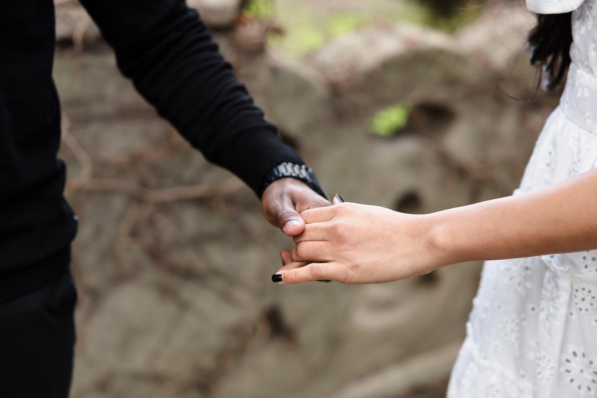 close up of couple holding hands during Kings Domain Engagement session