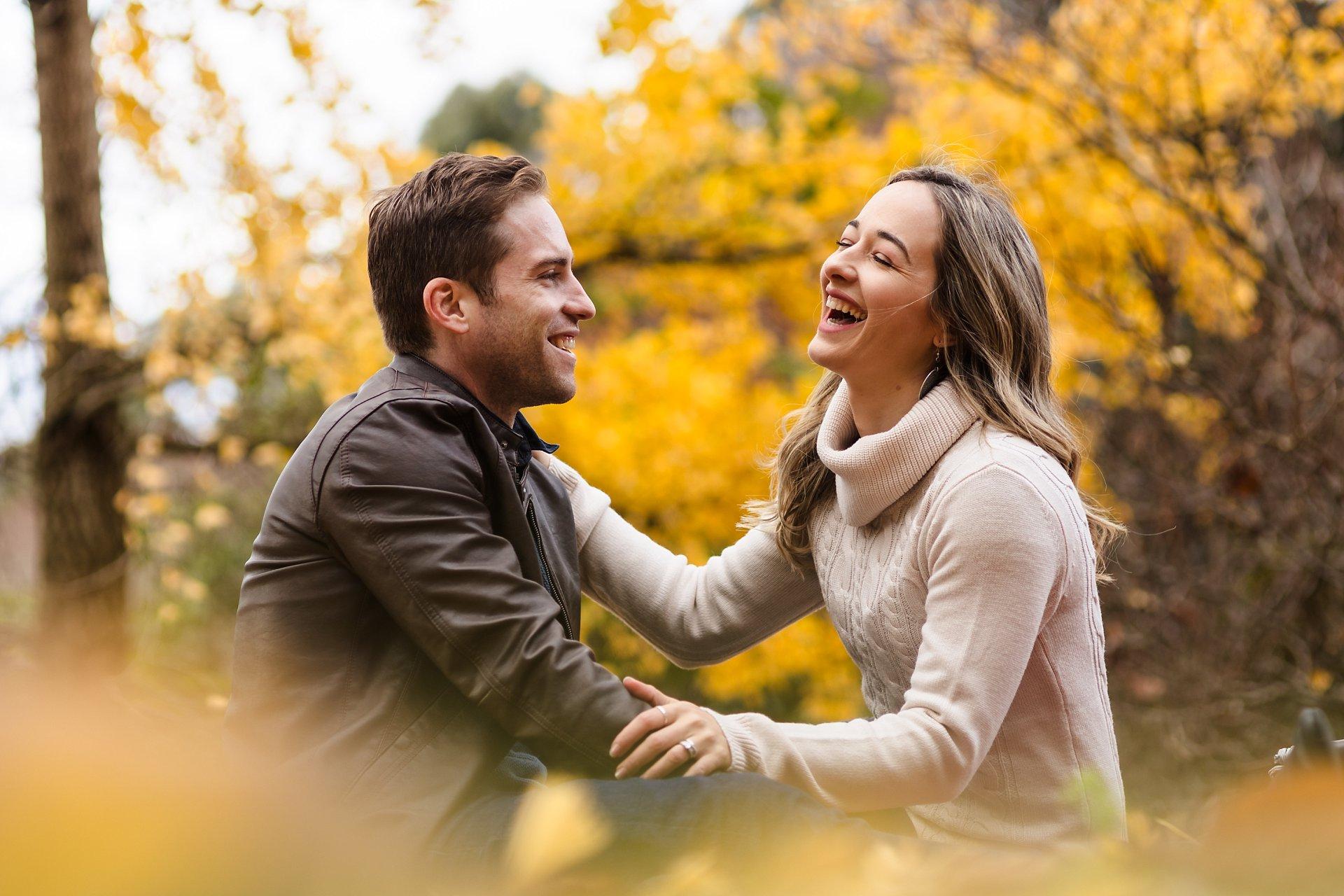 couple laughing during their portrait session in the dandenong ranges