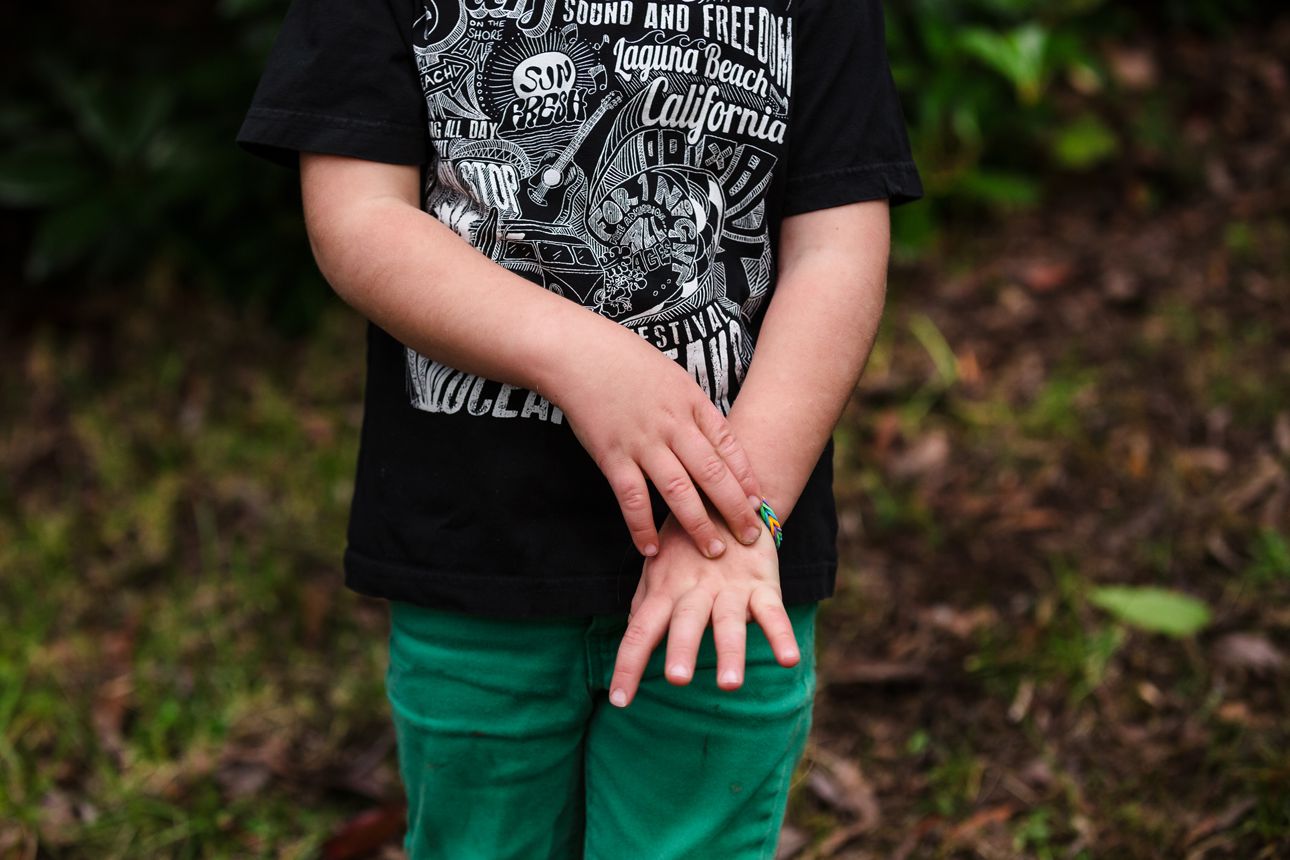 close up of hands during family photo session